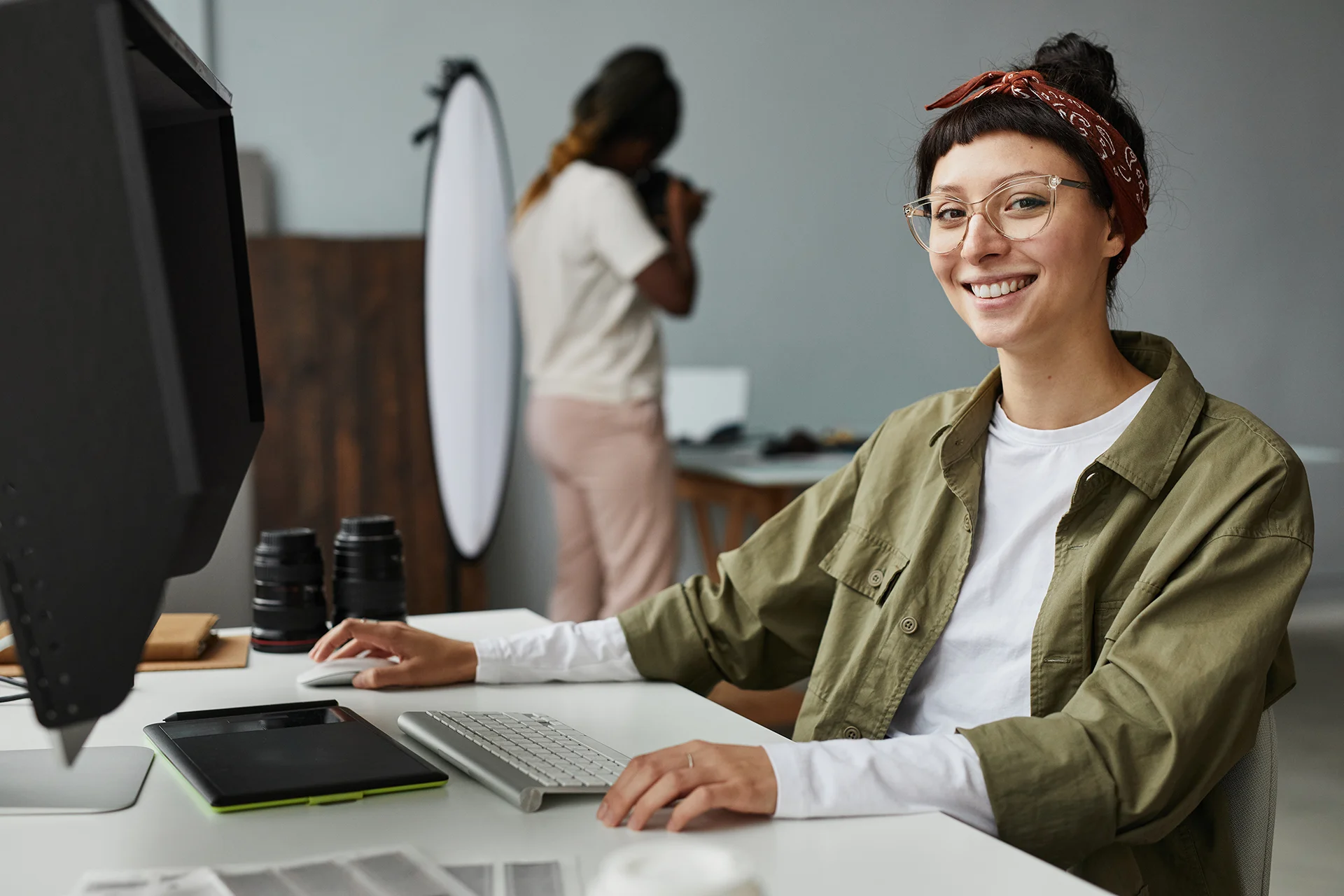 smiling female photographer using computer 2023 11 27 05 07 44 utc
