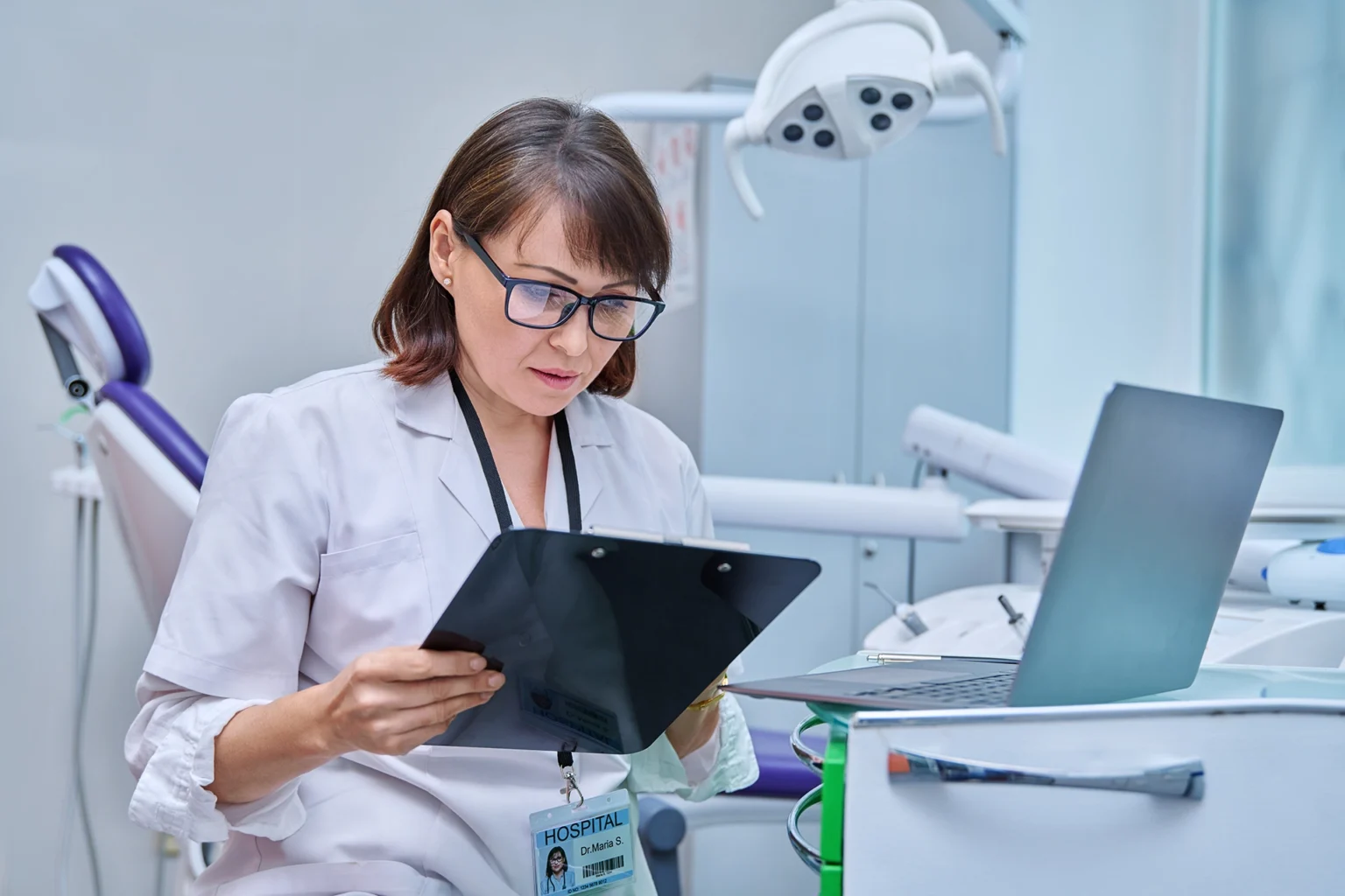 doctor dentist working in office using laptop ma 2026 03 17 00 20 21 utc