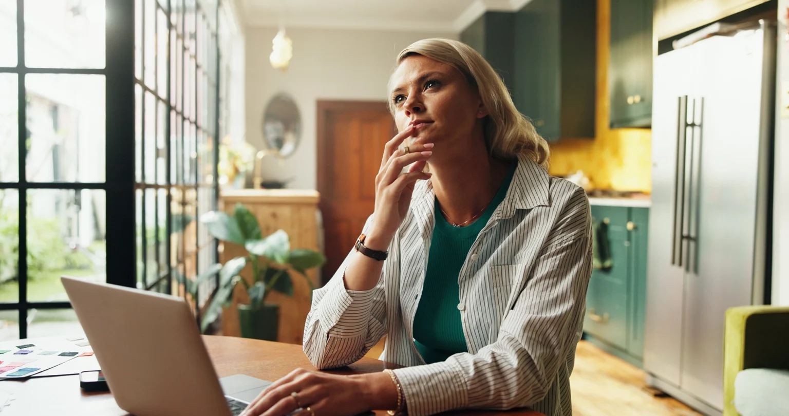 thoughtful woman working on laptop in bright home 2026 06 02 18 44 06 utc